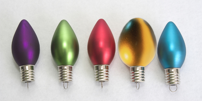 GreyDuck egg standing out amongst holiday lights